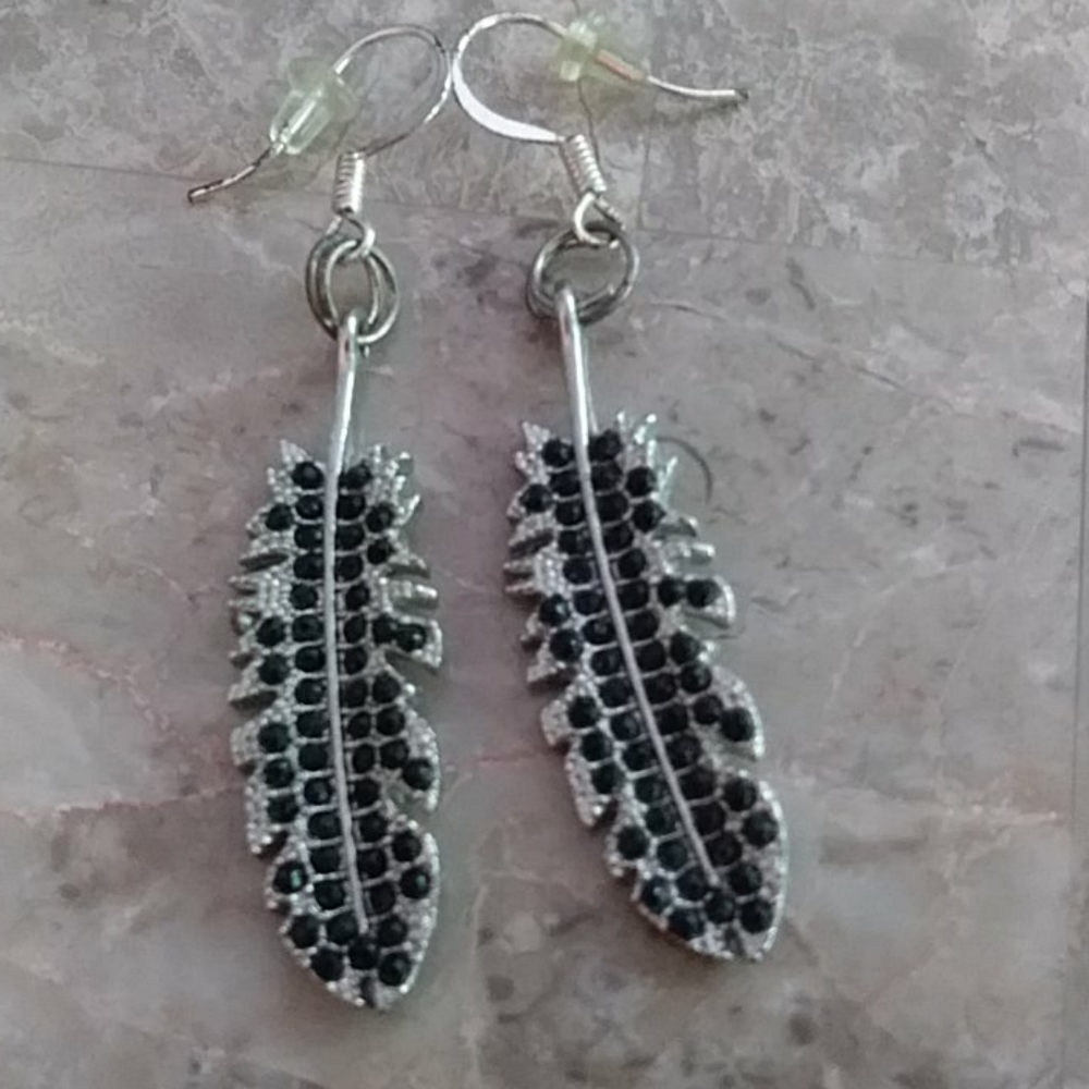Metal feather earrings...3 Pairs 16.00...must buy 3 Pairs